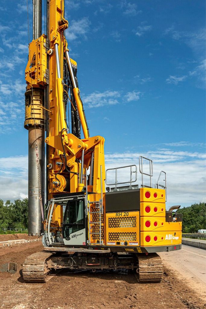 Delmag RH 20 rotary drill rig in yellow finish on a job site