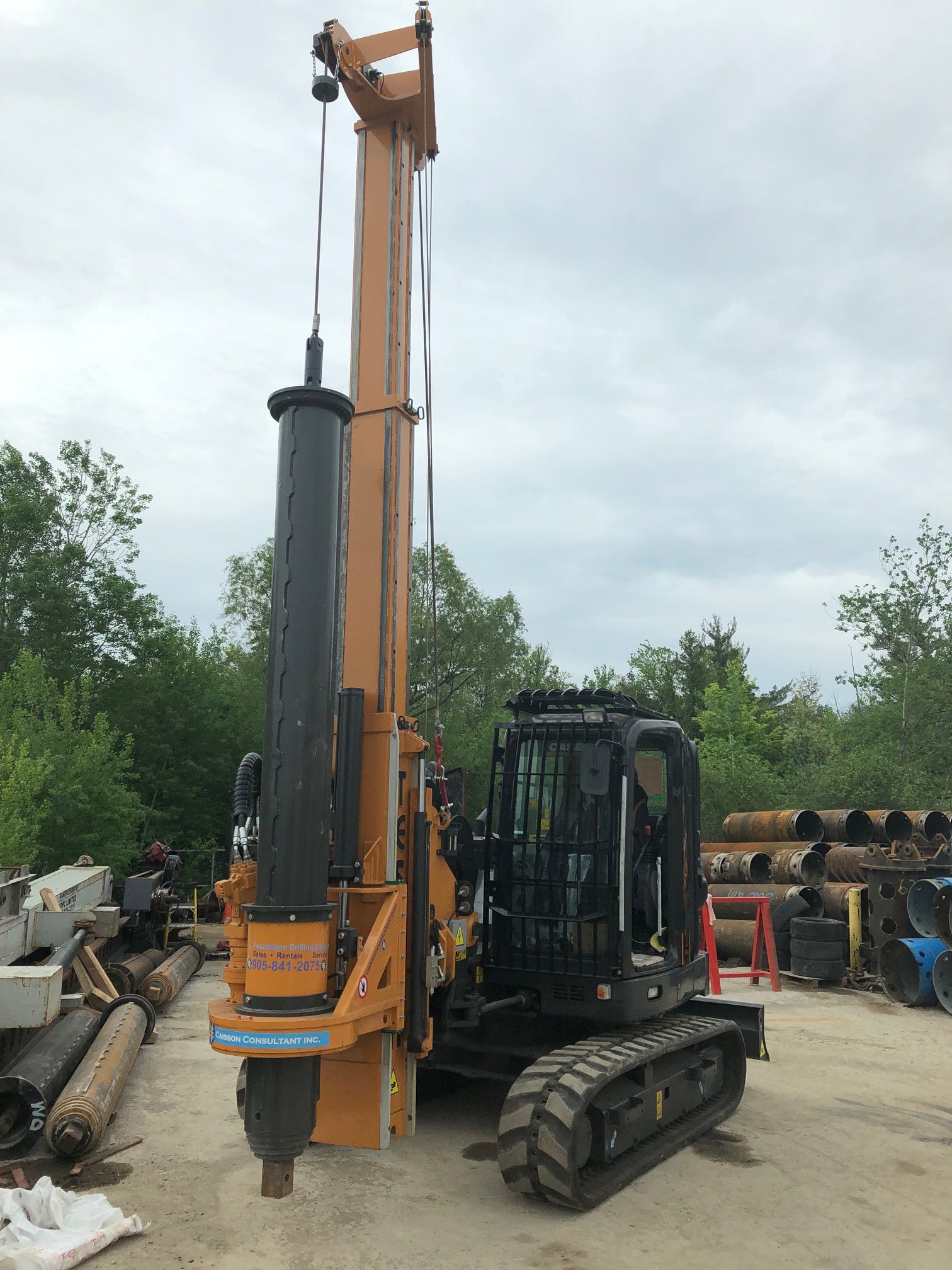 Foundation drilling accessory inventory staged outdoors