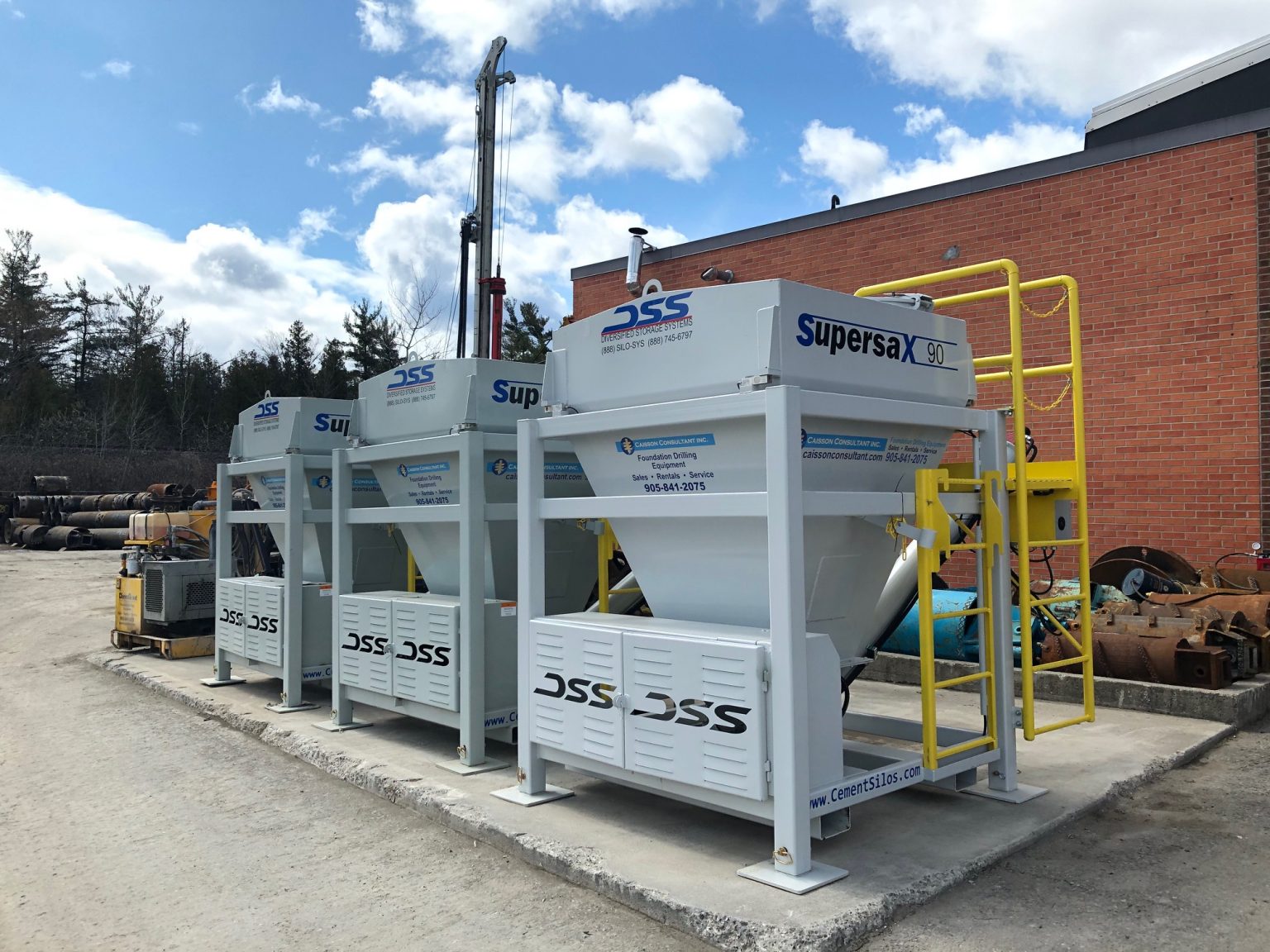 Yard inventory showing drilling accessories and support equipment